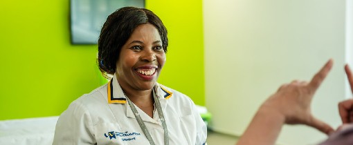 A nursing student speaking to another person.