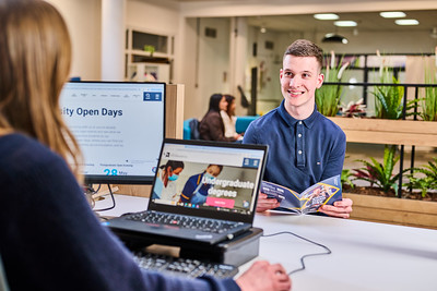 A photo of a student at a helpdesk