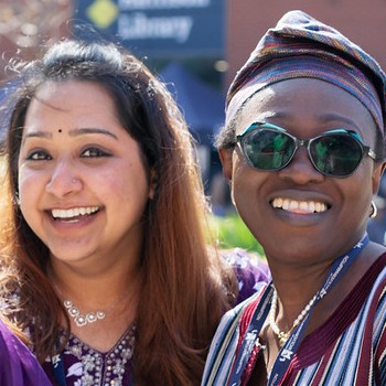 Two students posing for a photo at the International Fair