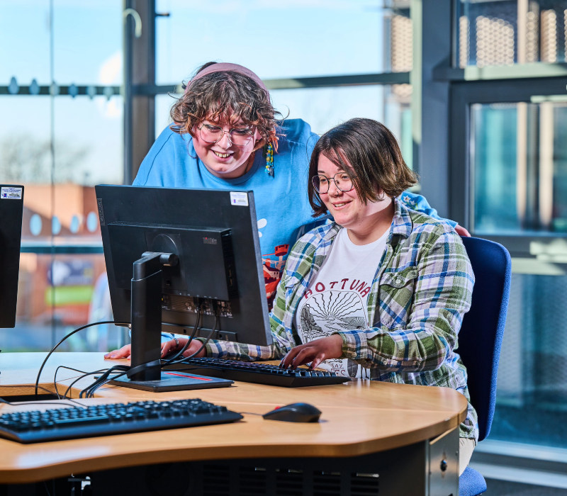 Students working together at a computer