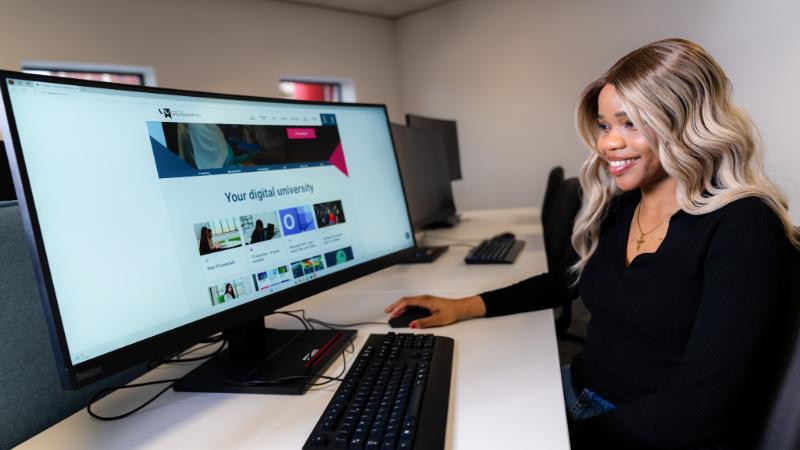 A student sitting at a computer