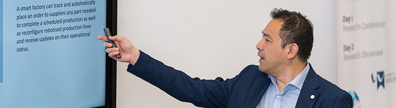 Man pointing at a board