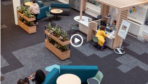 Students sitting on chairs in library