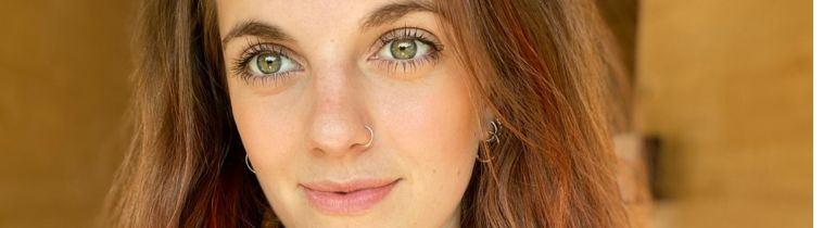 Alumni Zara smiling at camera