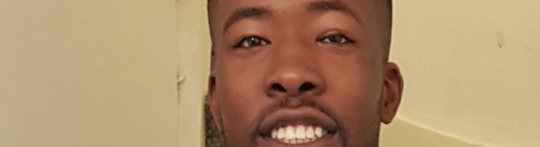 Alumni Leo Davis smiling at camera