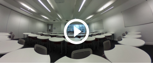 a teaching room with chairs and tables