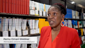 PhD student in red blazer