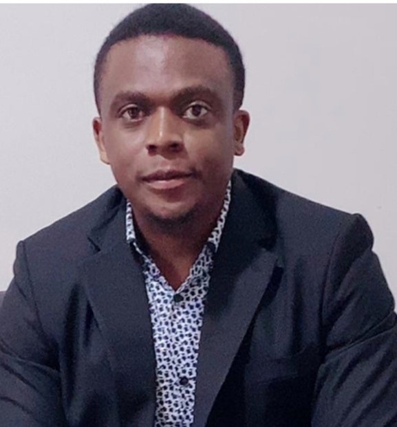 A male student in a suit