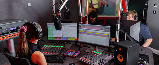 Students using the recording in the radio studio