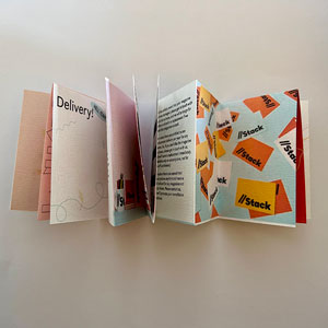 A folding magazine with various pieces of artwork by Amy Cole.