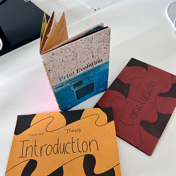 Three magazines by Amy Cole titled INTRODUCTION, CONCLUSION and PRINT EVOLUTION.