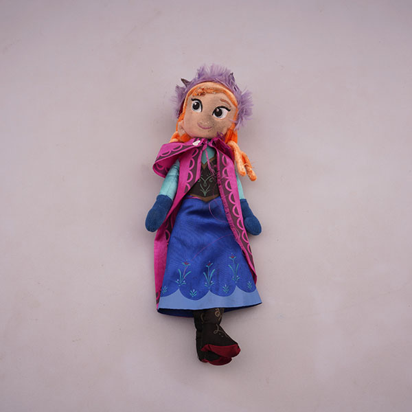 Photograph of a plush doll with its face dirtied.