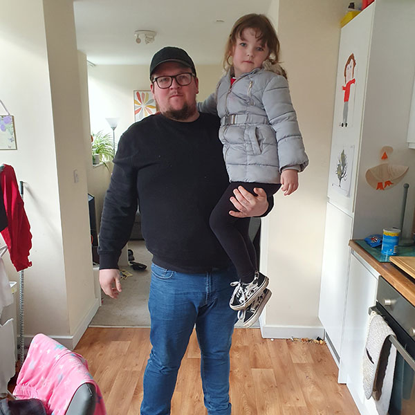 Photograph of James Gurdin holding his daughter