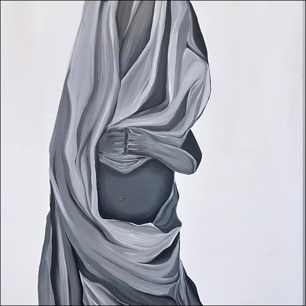 A figure wrapped in a large cloth, holding their fists together