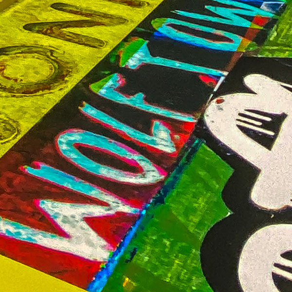 Framed collage of rows of graffiti slogans, including the words WONKY and WOLFTOWN.