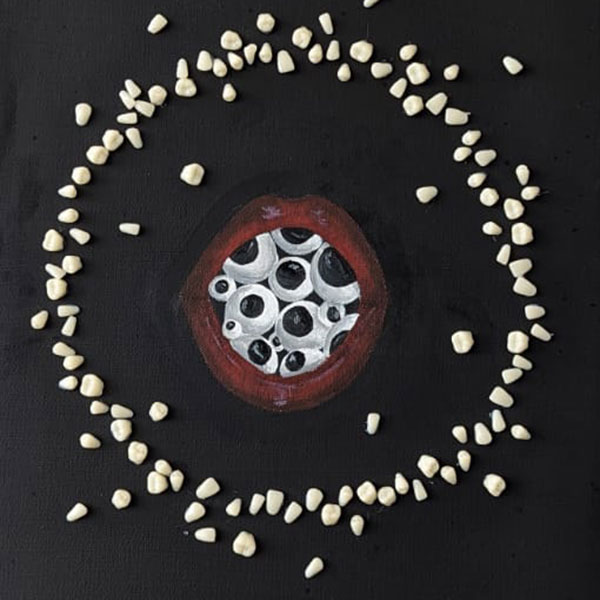 Painting of a pair of lips opening to a mouthful of eyes, surrounded by a circle of stones on a black background.