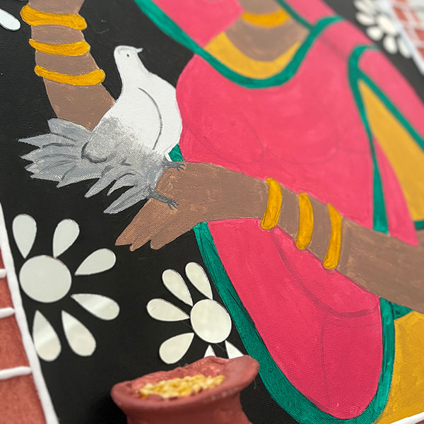 Corner of a painting of a woman with a bird standing on her hand, a clay construction of a pot of gold coins stuck to the image.