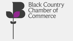 Black Country Chamber of Commerce logo. An graphical, semi abstract, representation of a flower in bloom. the design is mostly black except for one bright purple leaf. The accompanying black text, to the right of the image, reads: 