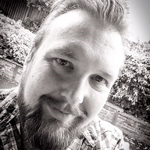 Portrait of Photography graduate, Dan Eccleston he is smiling