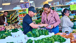 Students shopping at a greengrocers