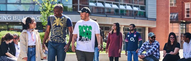 Group of students talking and walking towards the camera