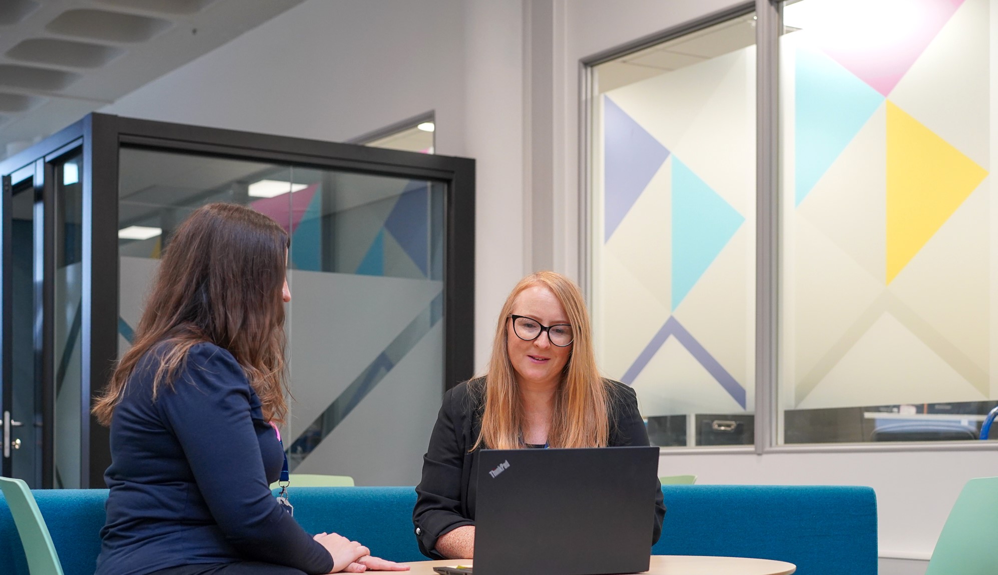 Staff members sitting at table