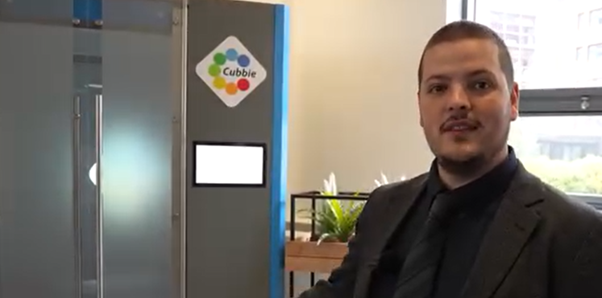 Man standing next to cubbie