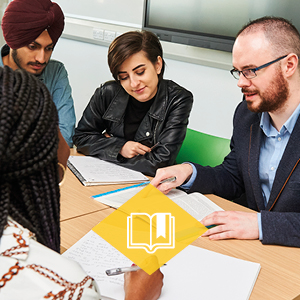 Students getting advice from a member of staff