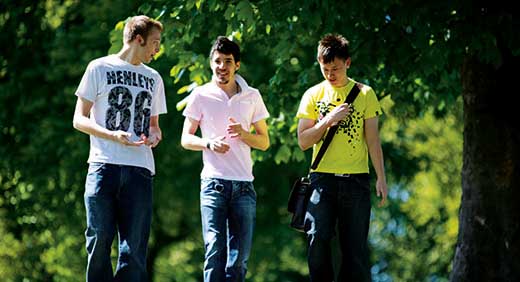 3 people walking and talking 