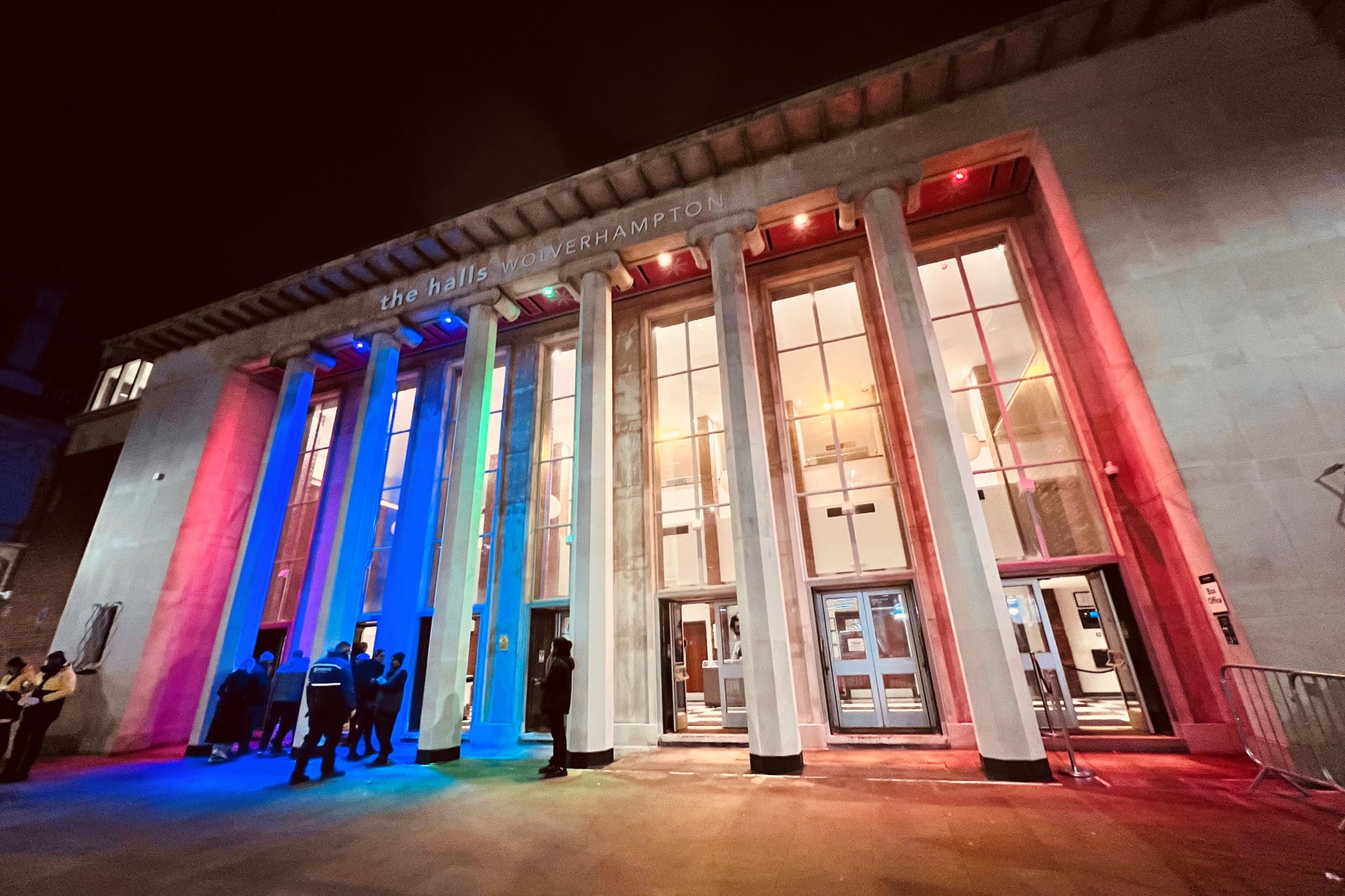 The Halls building illuminated at night