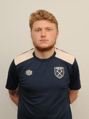 Student in football uniform looking at camera