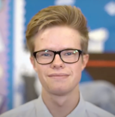 Student Chris smiling at camera