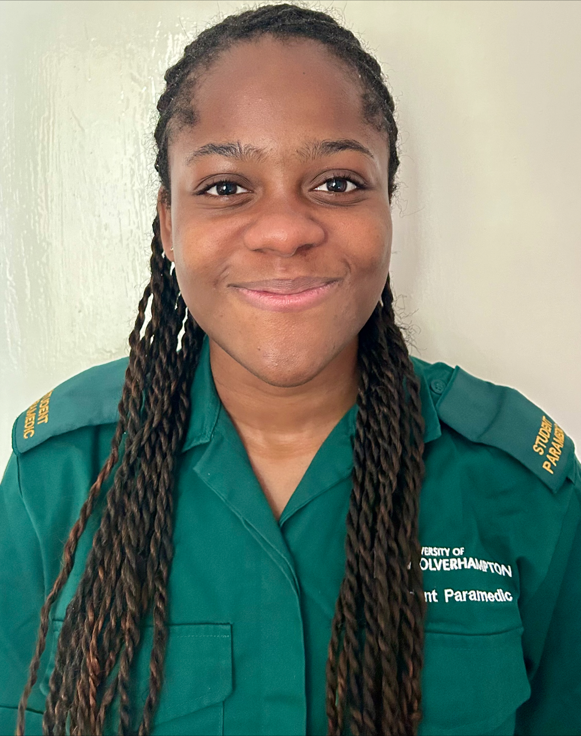 Student Esther in Paramedic Science uniform smiling