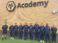 Students from academy standing together and looking at camera