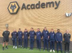 Students from academy standing together and looking at camera