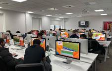 Students sitting in classroom at computers