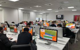 Students sitting in classroom at computers