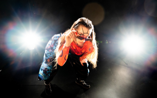 a woman squatting with sunglasses
