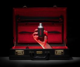 a photo of a hand coming out of a briefcase