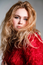 a photo of a woman in a red top