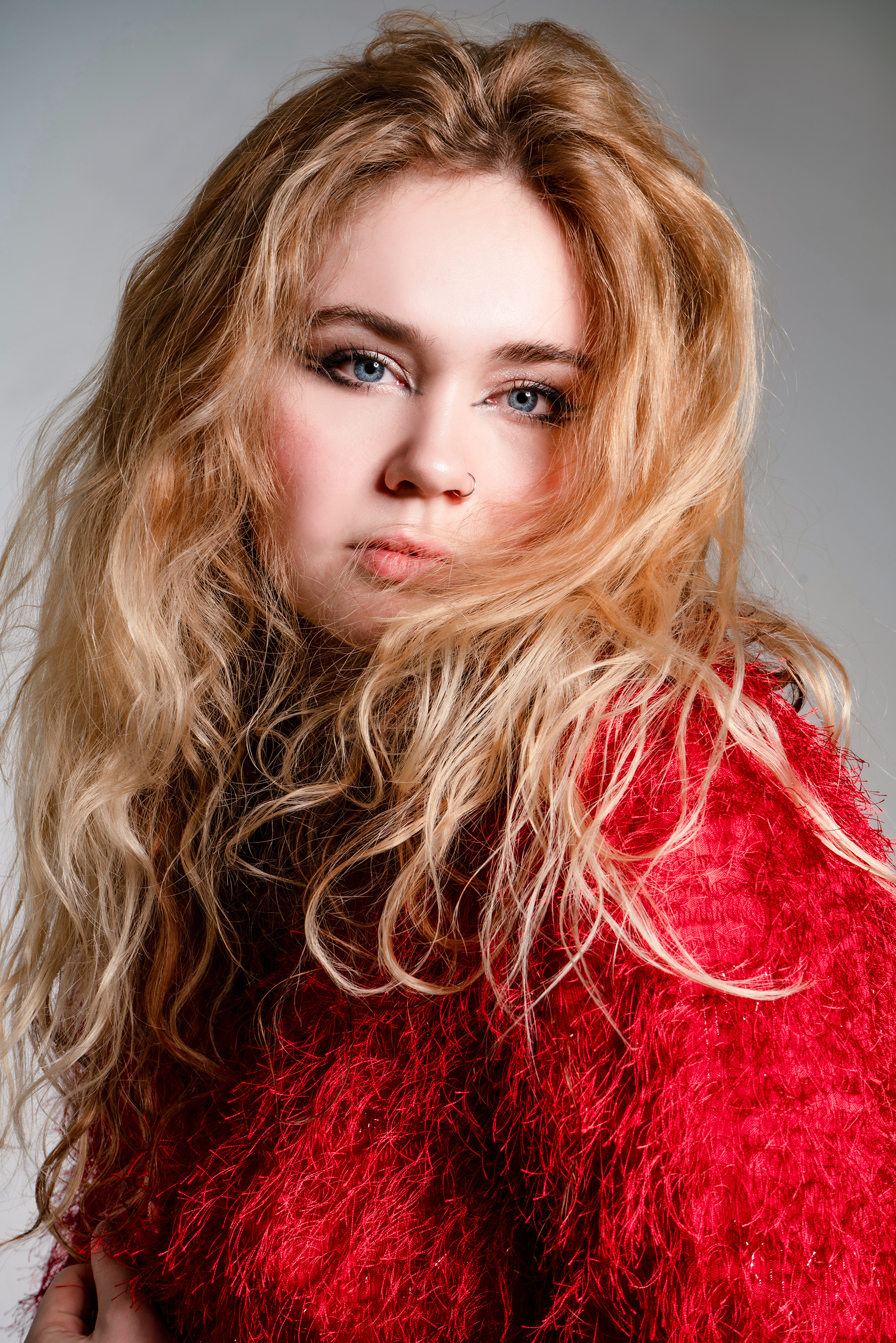 a photo of a woman in a red top