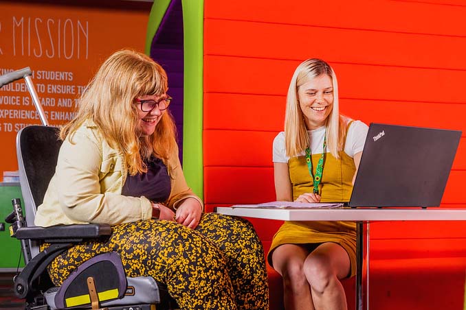 students using a laptop