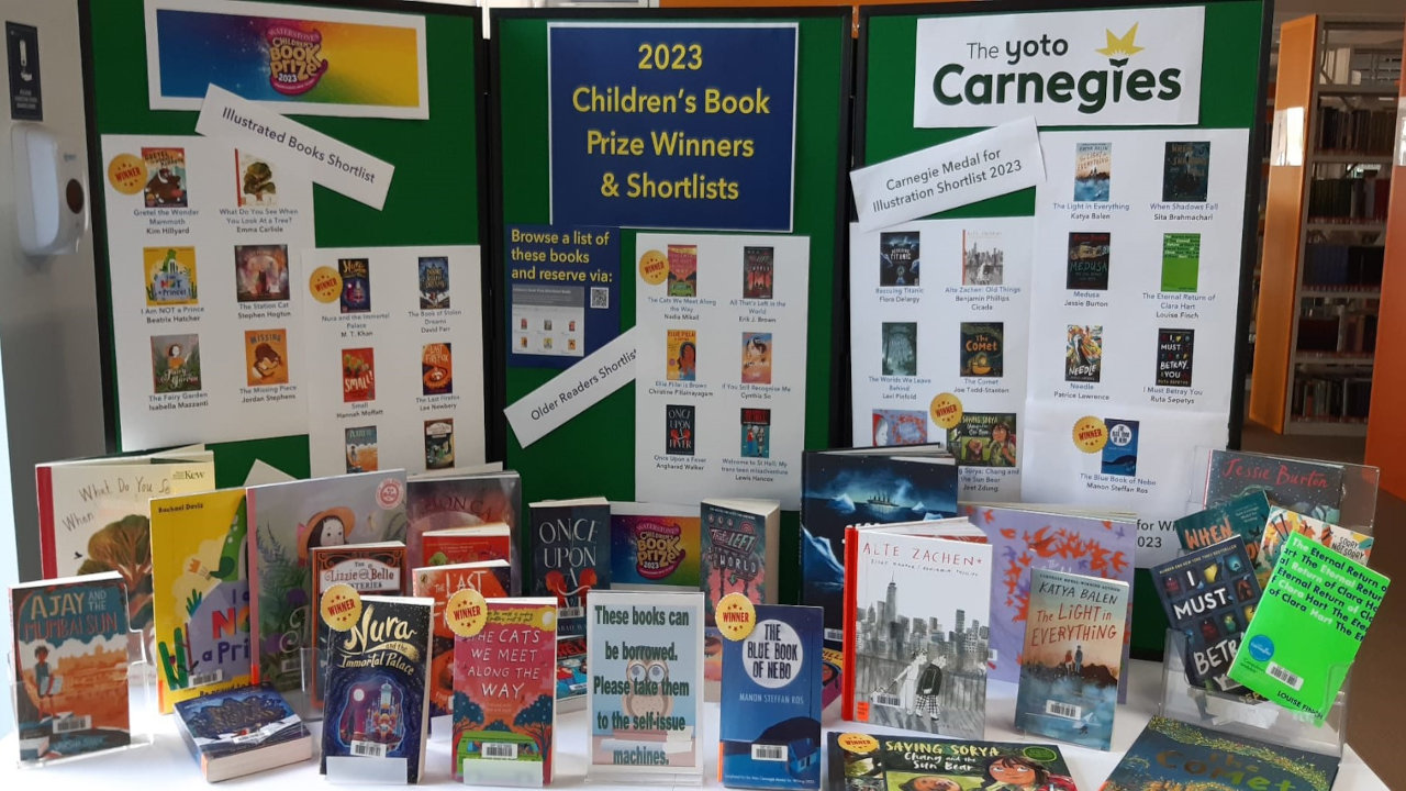 2023 Childrens book prize winning books in front of a display board