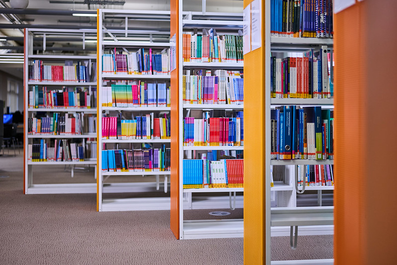 Image of Library shelves with dimmed lights