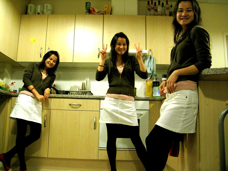 The same person appears at three points in a kitchen.
