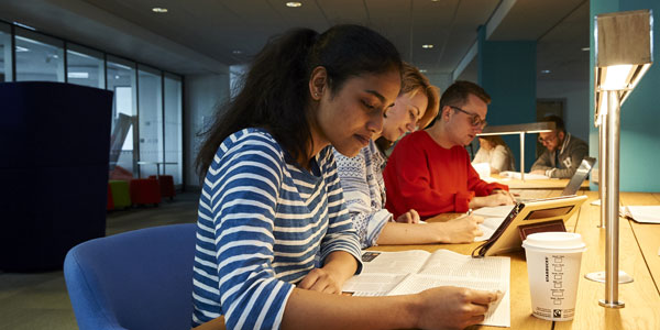 A photograph of a group students studying in the Housman building at the University of Wolverhampton City Campus.