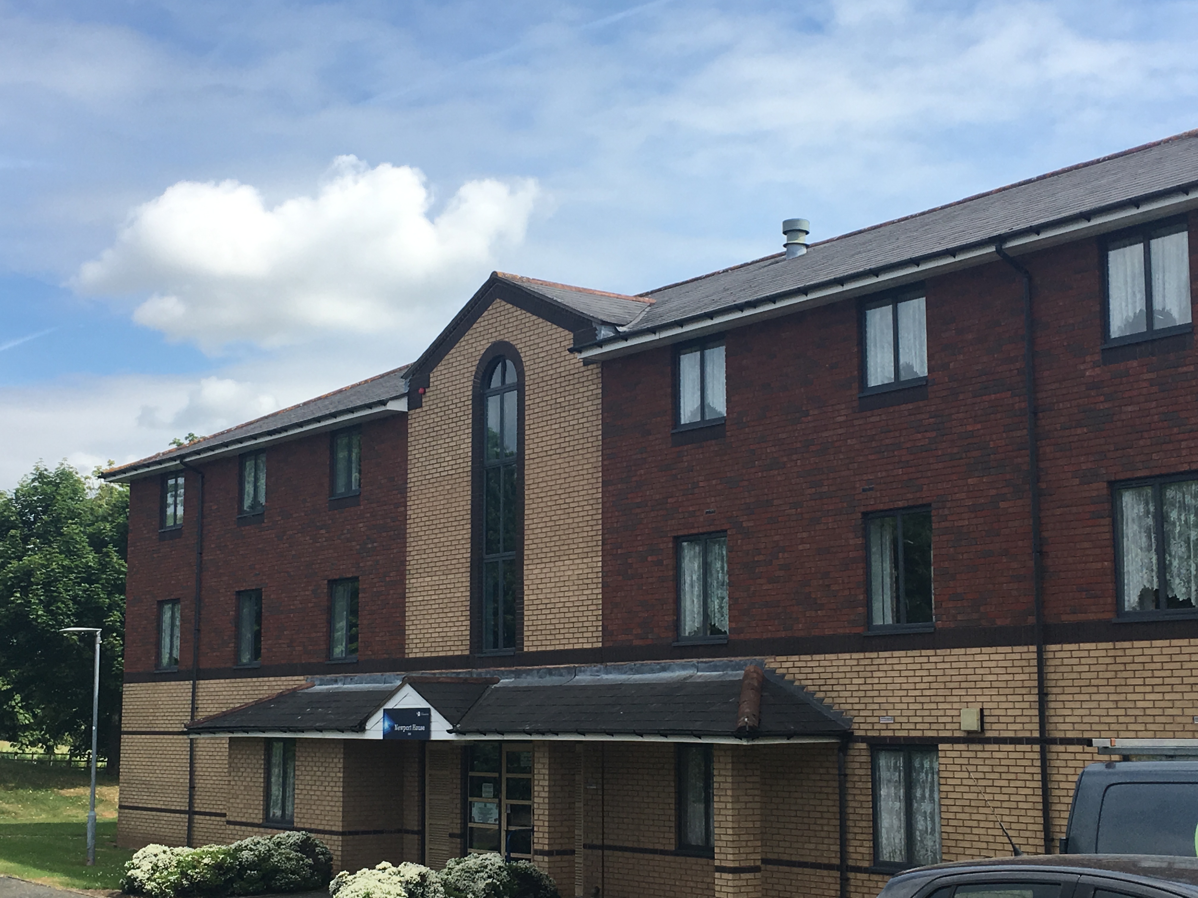 Exterior of the Newport House accommodation building at Telford Campus, the name of the building printed above the entrance