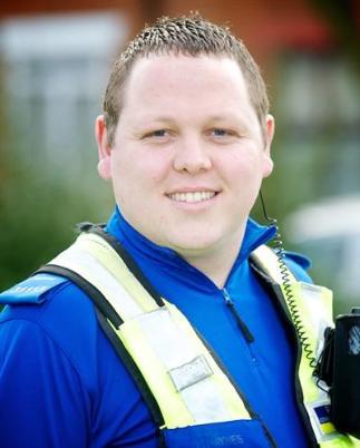 Profile photo of Lee Haynes wearing a West Midlands Police high-vis jacket
