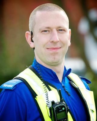 Profile photo of Matt Pilsbury, wearing a West Midlands Police high-vis jacket