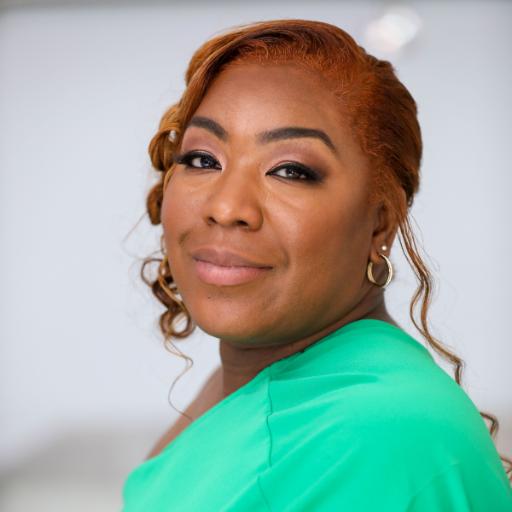 Side-on photograph of Chantel Brooks in a green outfit.